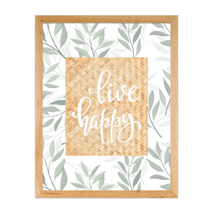 Artwork featuring the text live happy with green foliage pattern.